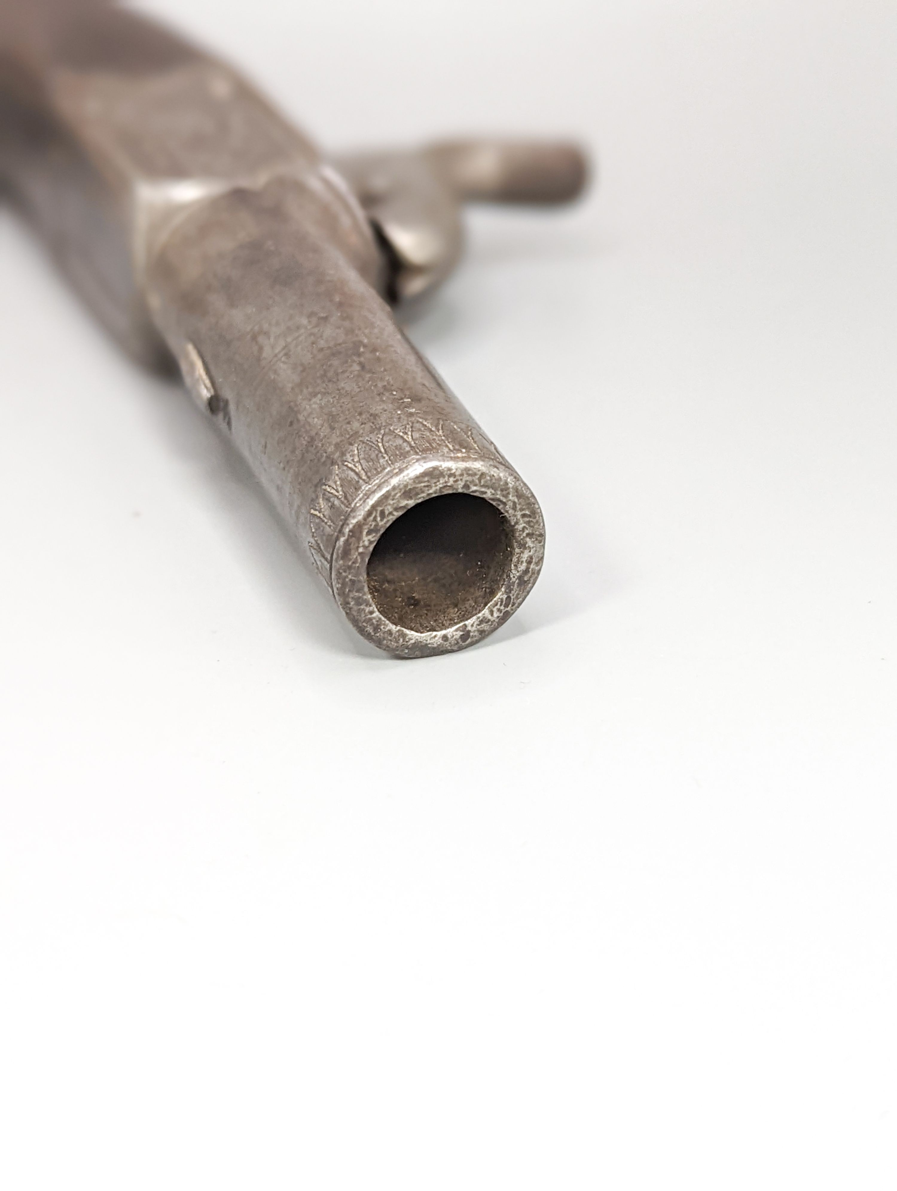 A 19th century pocket pistol, engraved makers mark G and J Deane London, 15.5 cm
